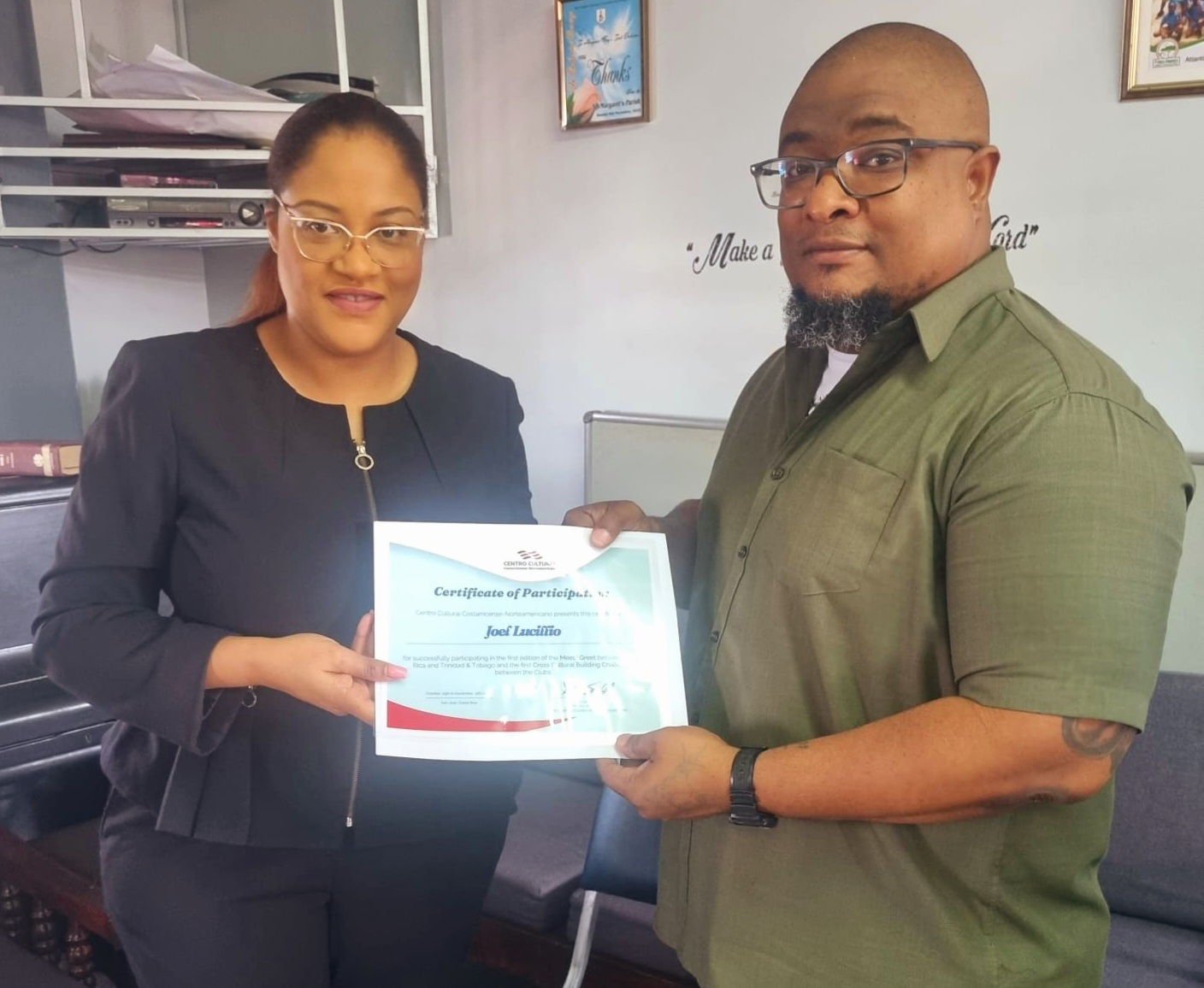 Certificate presentation featuring Mr. Lucillio